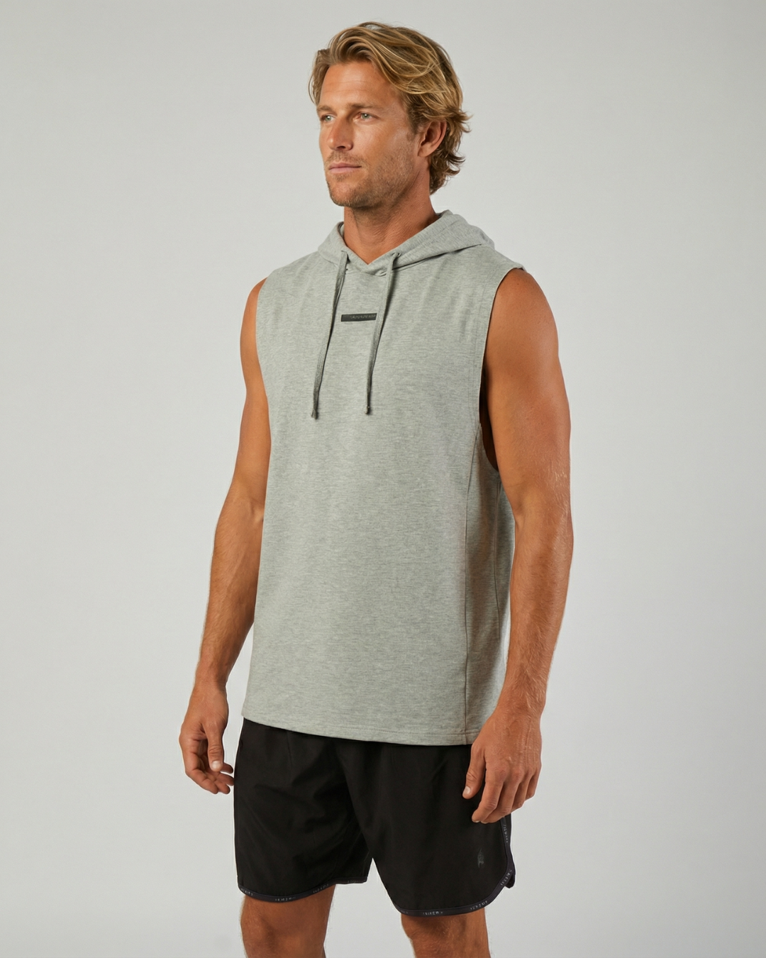 Model spiking a volleyball wearing the STAR Hooded Tank Top"