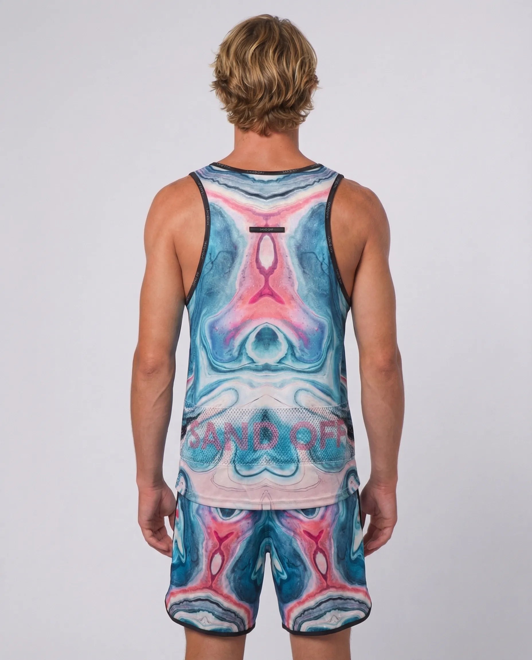 Back view of Astral Flow tank top featuring the patented Sand Off system for quick hand cleaning.