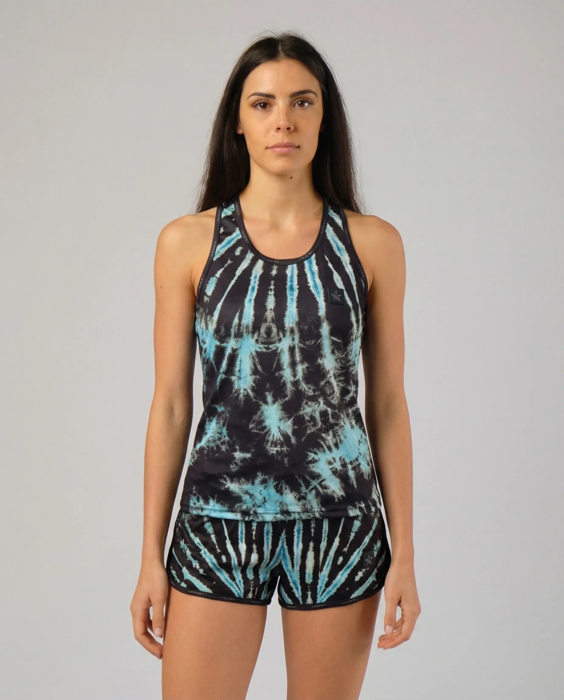 Front view of STAR Beachwear Cosmic Reef women's technical tank top for beach volleyball.