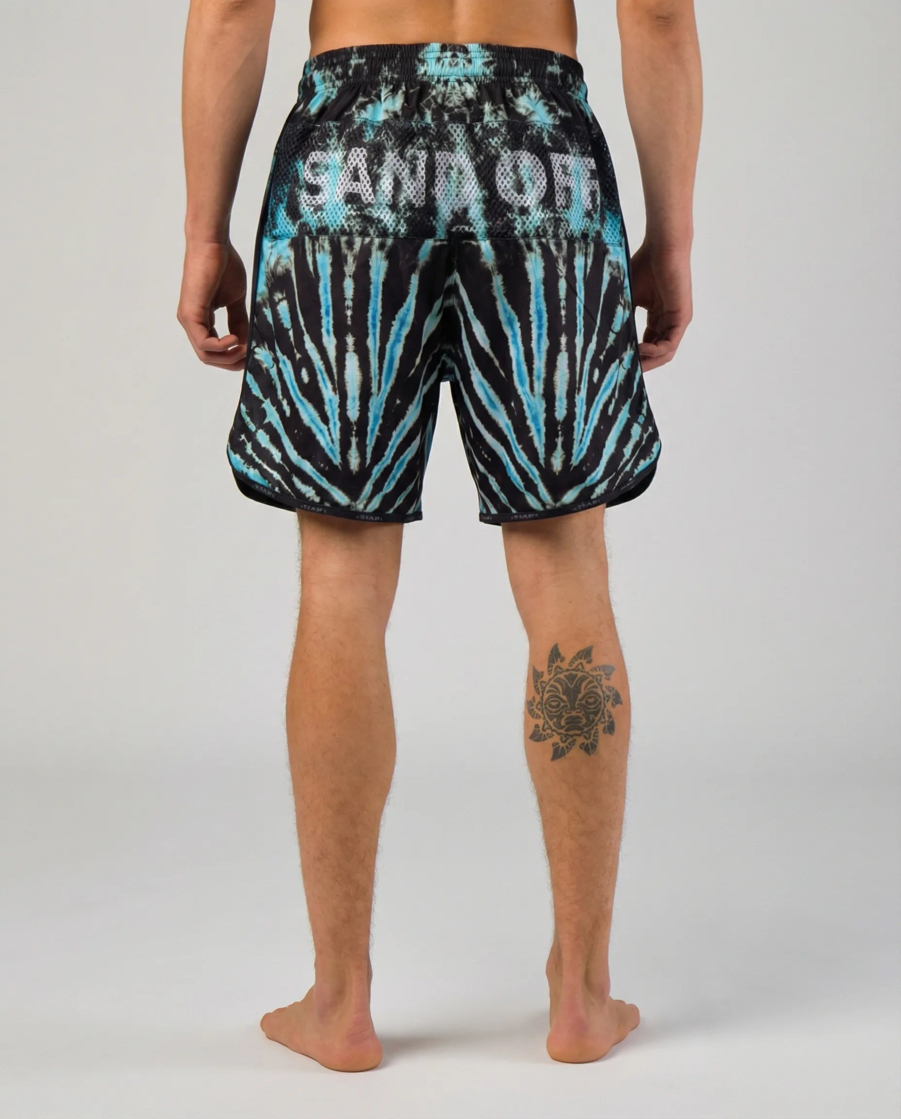 Back view of Cosmic Reef shorts with the patented Sand Off system for instant hand cleaning on the court.