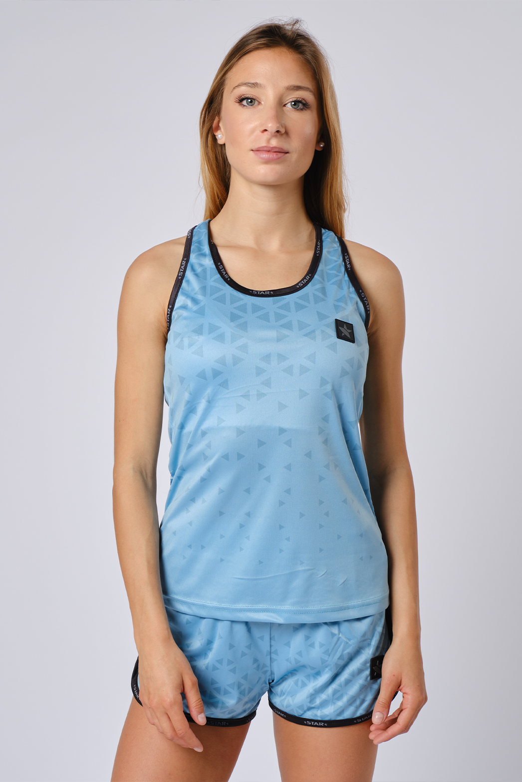 STAR Meteorite women's performance tank top with dynamic graphics, slim fit sand-off gear in multiple colors for beach volleyball.