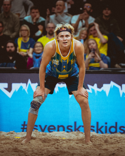 STAR Beachwear athlete training on the sand with sustainable performance gear.