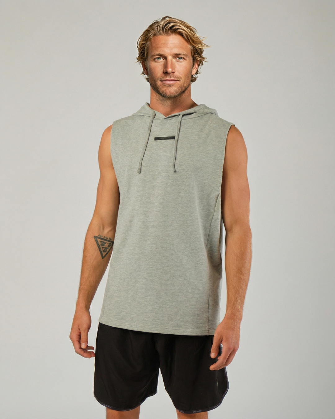 Model spiking a volleyball wearing the STAR Hooded Tank Top"