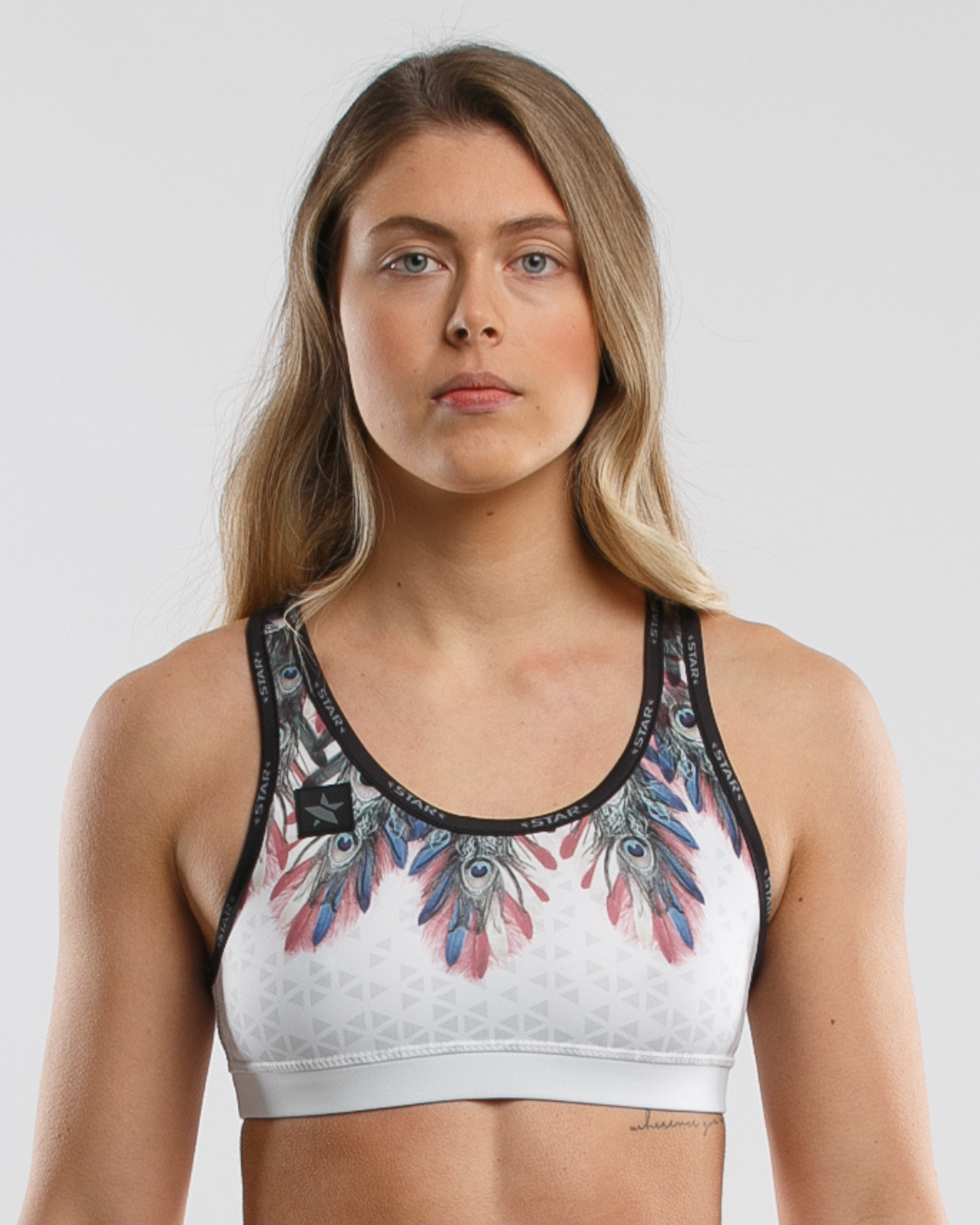 STAR Peacock Court Top high-performance beach volleyball sports bra with Sand-Off technology, athletic fit.