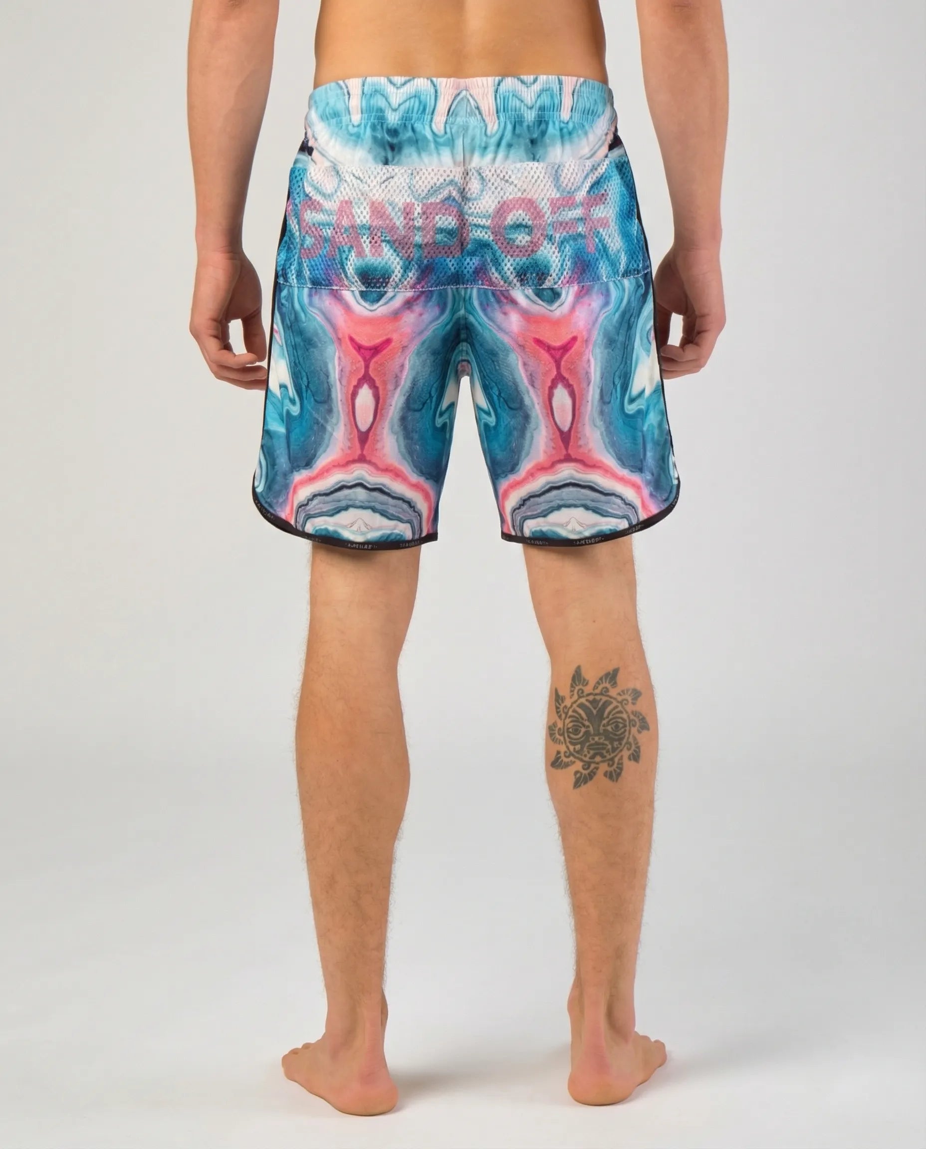 Back view of Astral Flow shorts with the patented Sand Off system for quick hand cleaning on the sand.